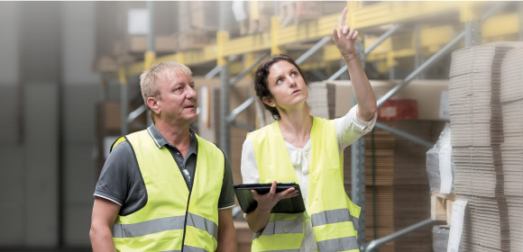 professional reviewing storage in a warehouse